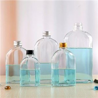 Botellas de café de vidrio de forma plana